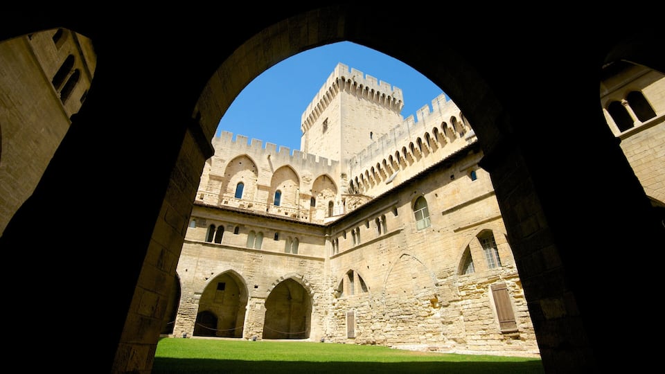 Palais des Papes which includes heritage architecture and a castle