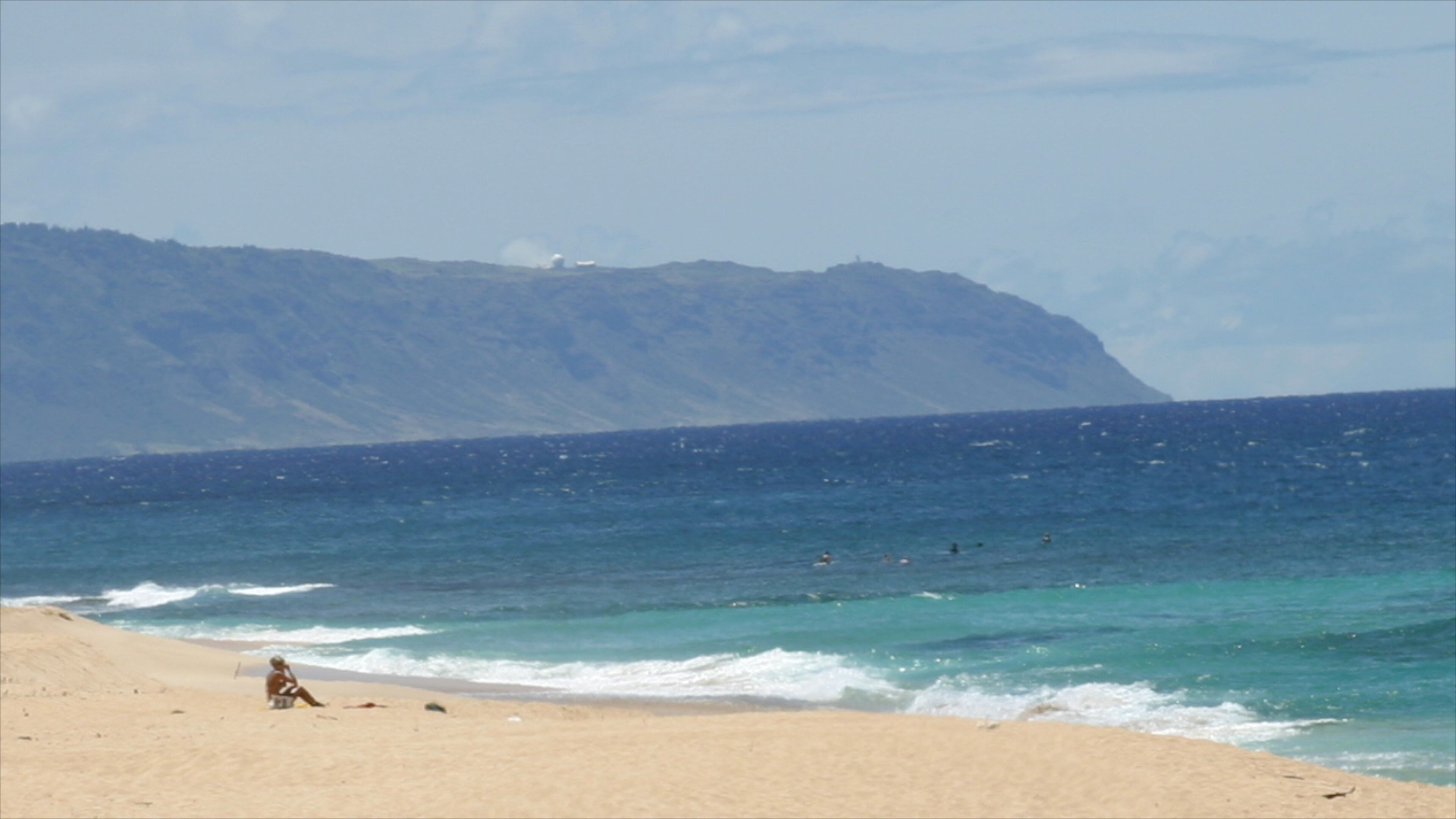Sunset Beach showing swimming, landscape views and a sandy beach