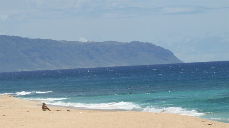 Sunset Beach showing swimming, landscape views and a sandy beach