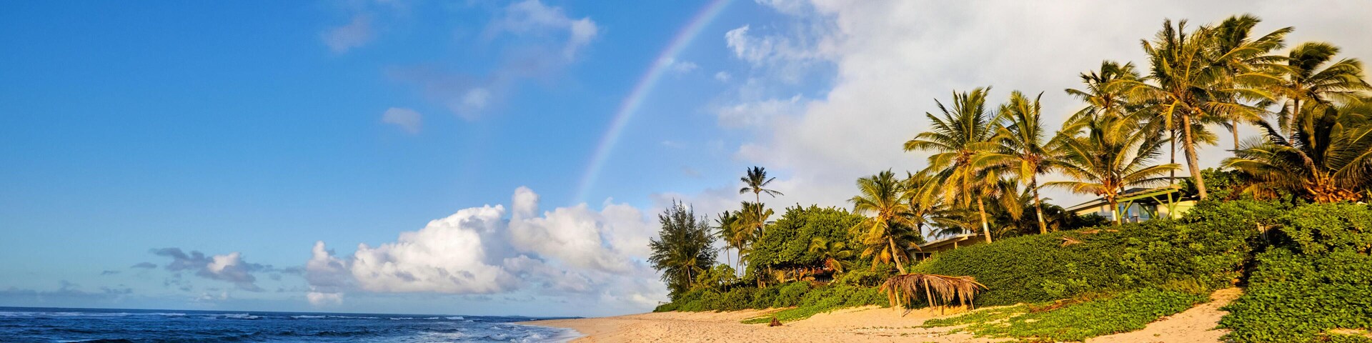 FYFX0G rainbow over the popular surfing place Sunset Beach, Oahu, Hawaii