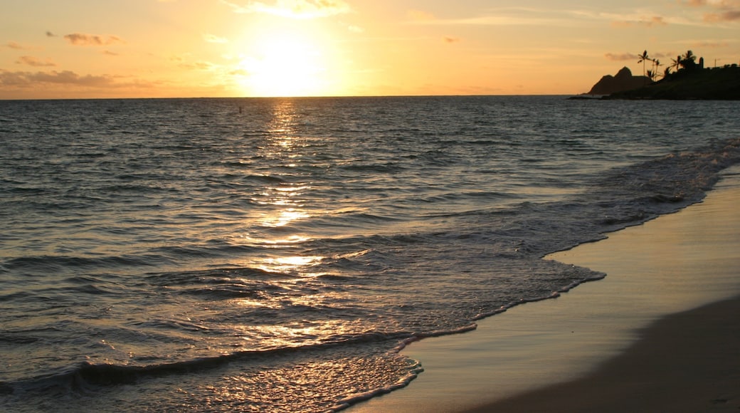 Waimanalo Beach featuring a sandy beach, a sunset and landscape views