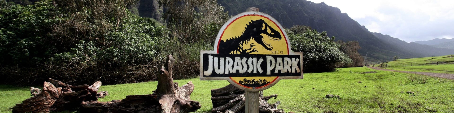 Kualoa Beach Park featuring signage, landscape views and mountains