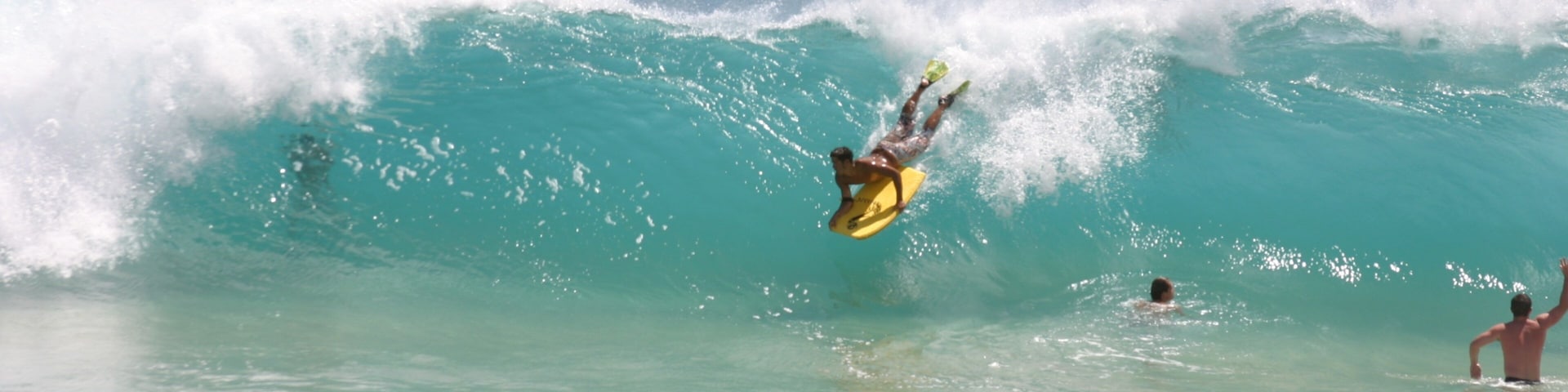 Makapuu Beach showing surfing and surf as well as an individual male