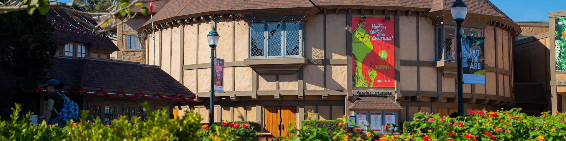 Old Globe Theater featuring a garden and wildflowers