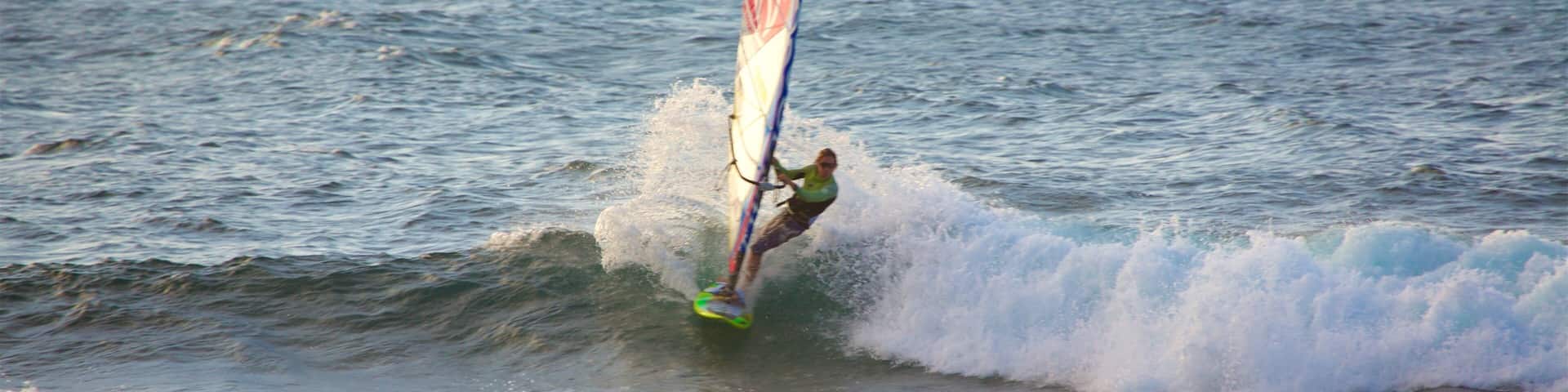 Hookipa Beach Park featuring general coastal views, kite surfing and a sunset