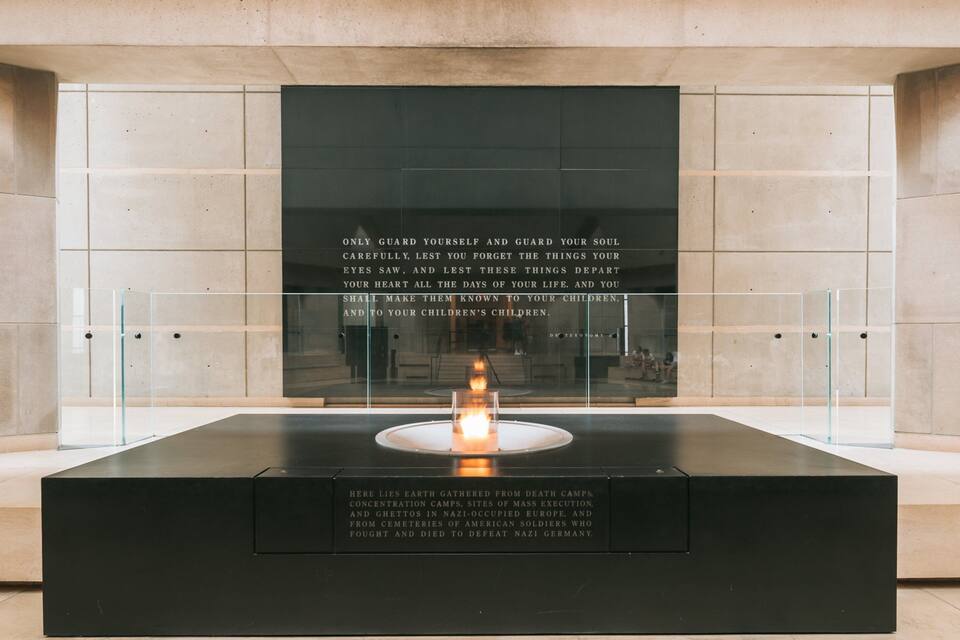 A memorial with a candle and inscriptions.