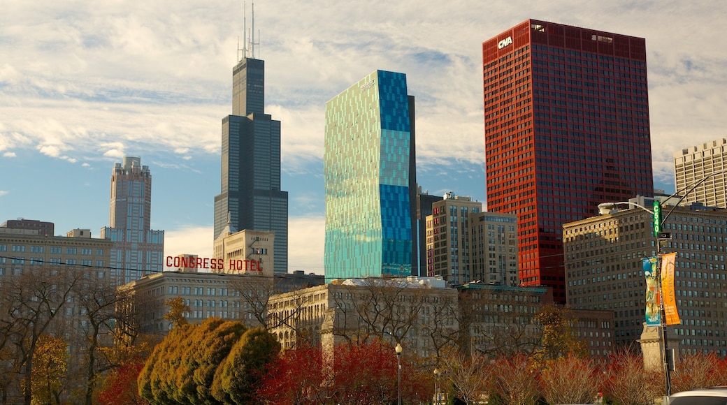 Millennium Park showcases colorful autumn foliage against the Chicago skyline with modern architecture and iconic landmarks