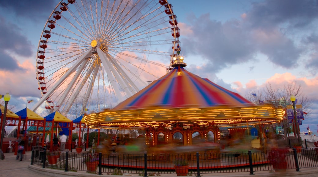 Navy Pier featuring a sunset and rides