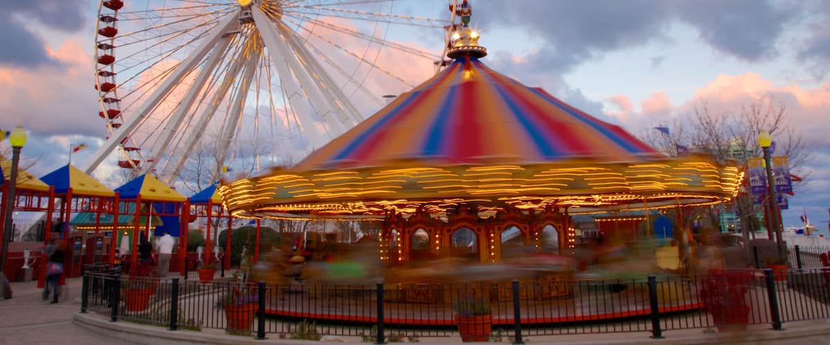 Navy Pier featuring a sunset and rides