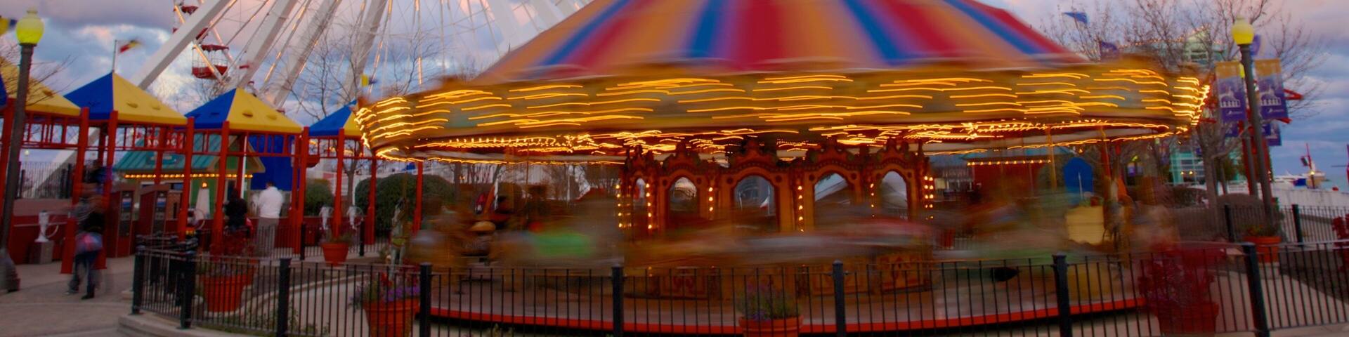 Navy Pier featuring a sunset and rides