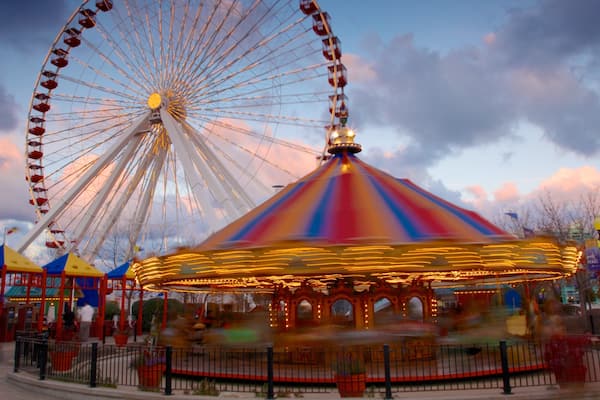 Navy Pier featuring a sunset and rides
