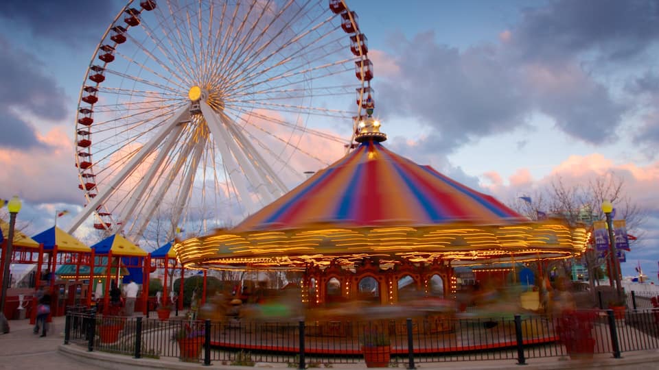 Navy Pier featuring a sunset and rides
