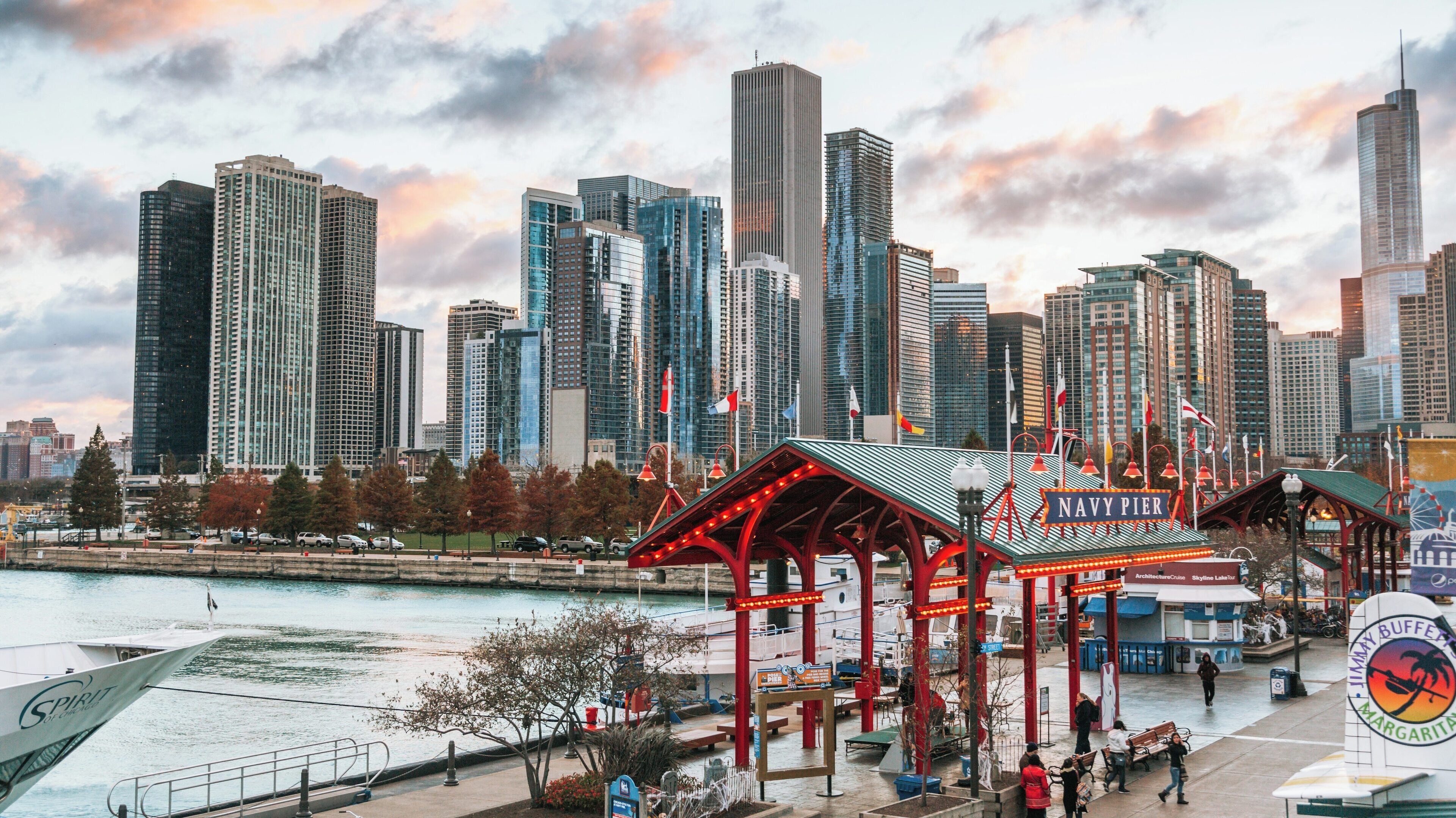 Navy Pier and Chicago skyline at sunset showcasing vibrant city life and stunning architecture