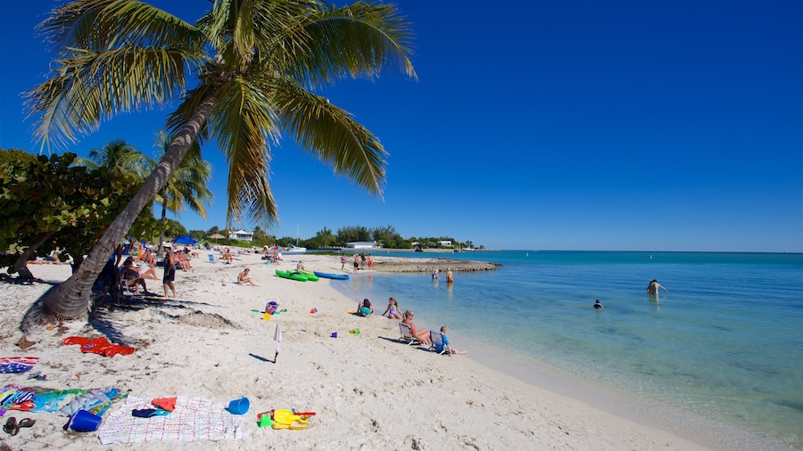 Sombrero Beach showing a sandy beach and a bay or harbor as well as a small group of people