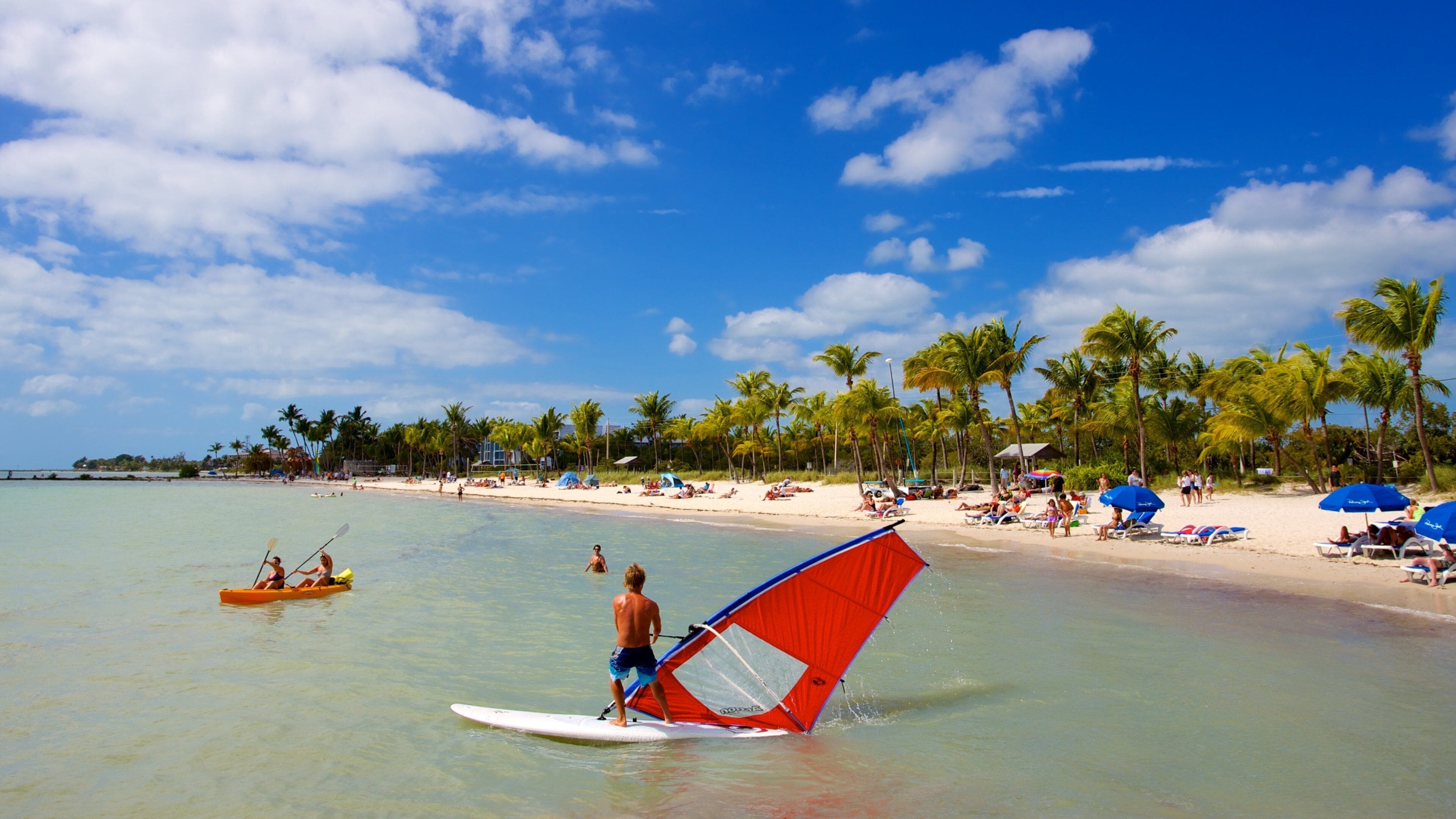 Smathers Beach showing a bay or harbor, tropical scenes and windsurfing