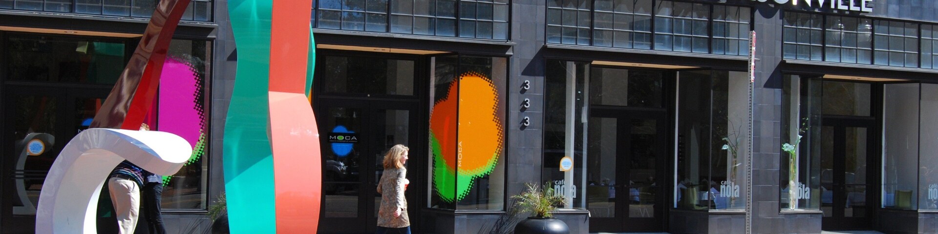 Jacksonville Museum of Modern Art showing street scenes as well as an individual femail