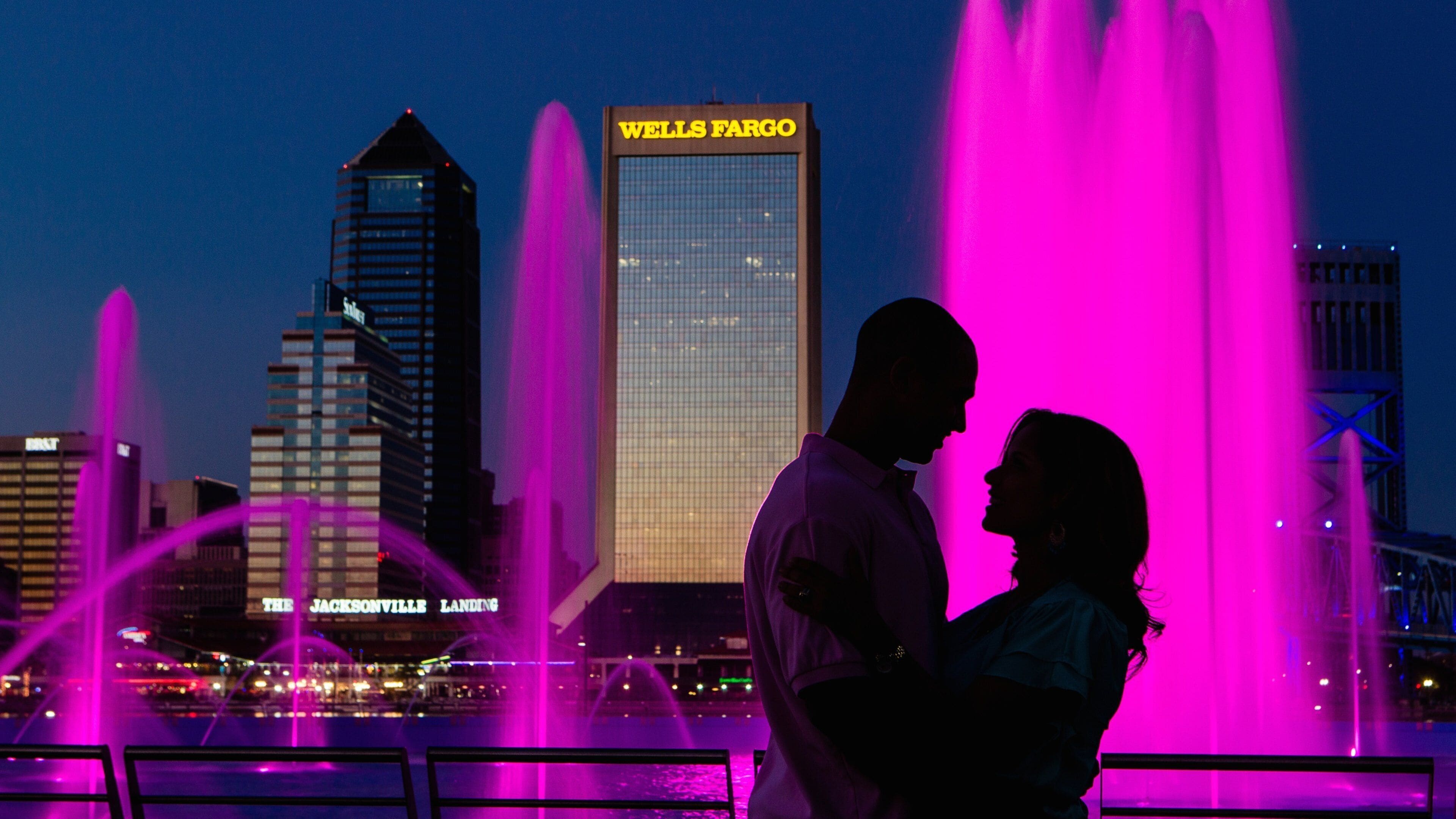 Friendship Park showing a fountain, a skyscraper and night scenes