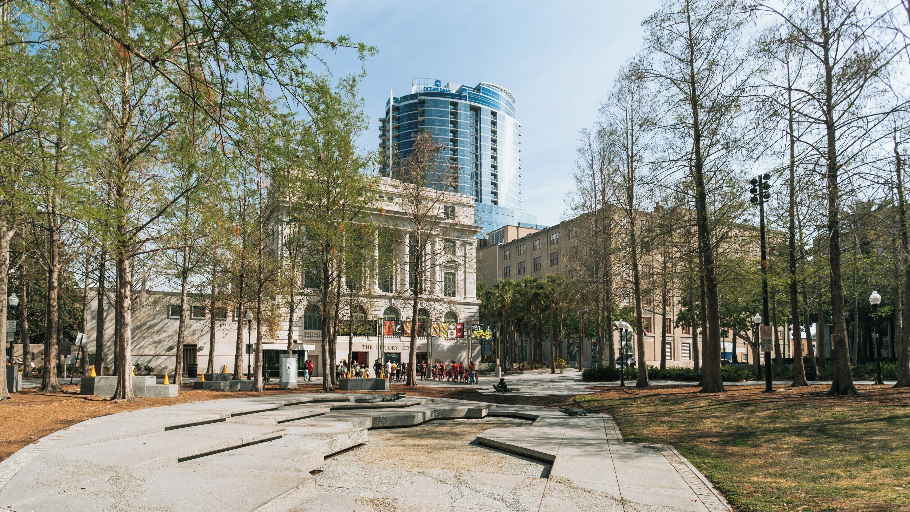 Exploring the Orange County Regional History Center amidst downtown Orlando's modern skyline