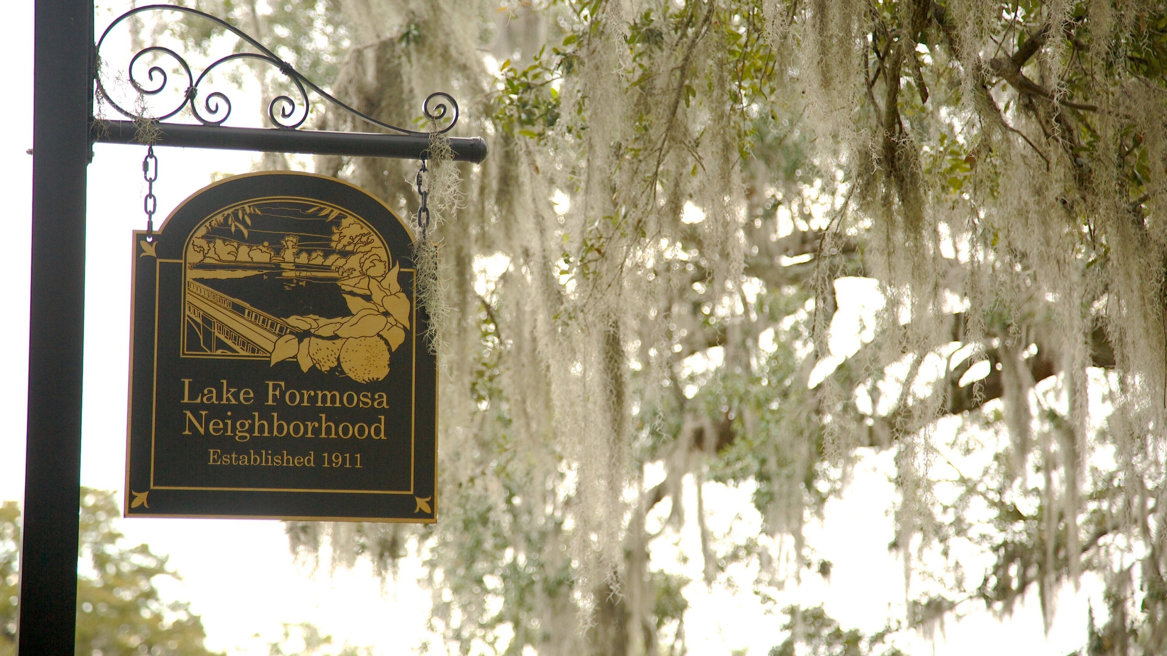 Loch Haven Park featuring signage and a park