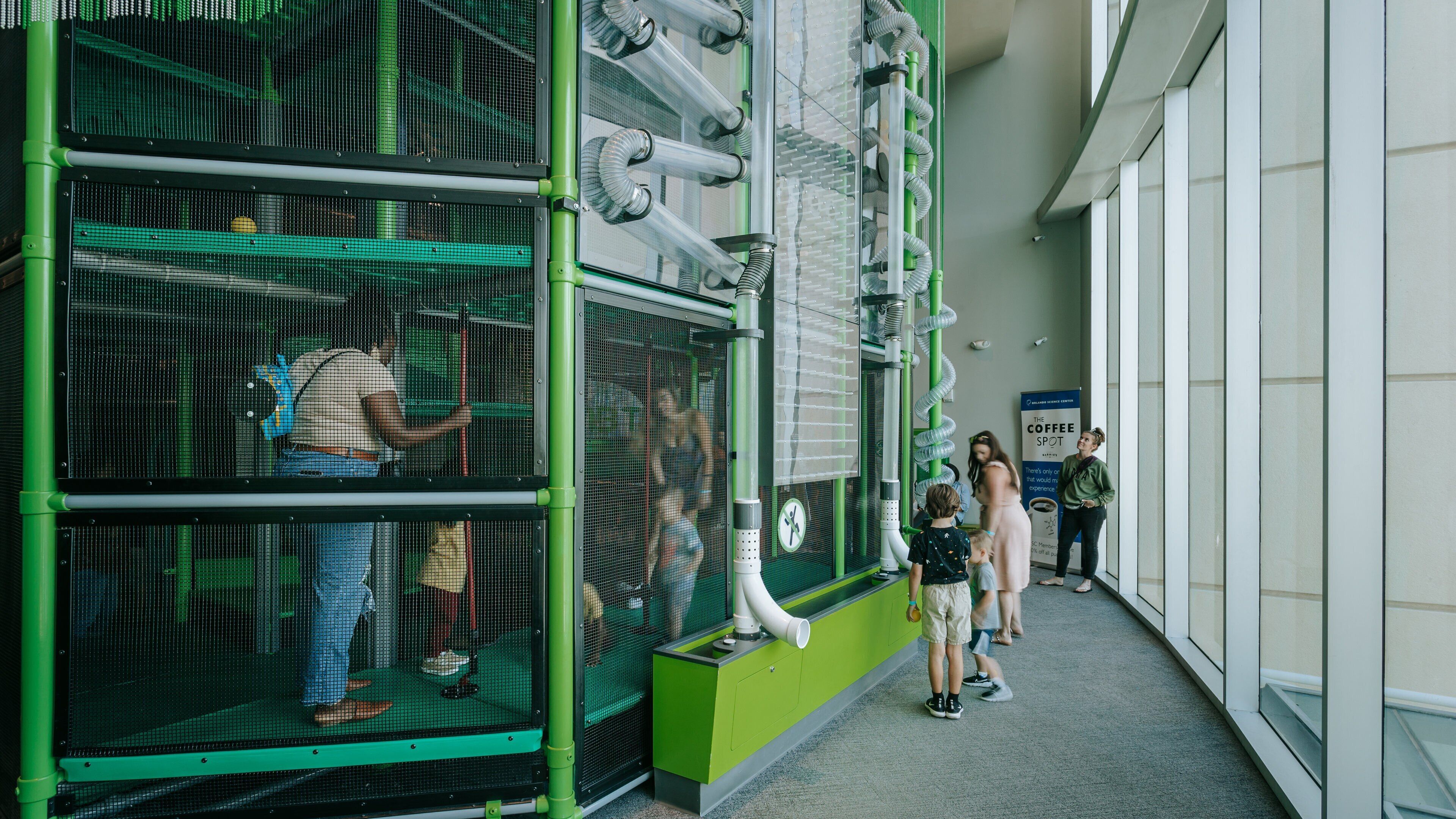 Orlando Science Center featuring interior views as well as a family