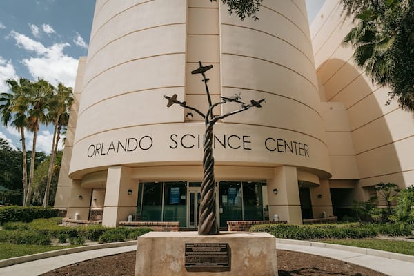 Orlando Science Center featuring signage and outdoor art