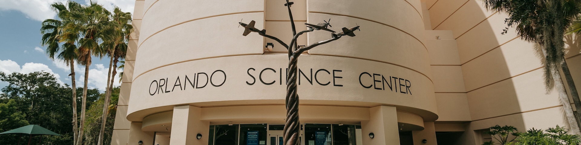 Orlando Science Center featuring signage and outdoor art