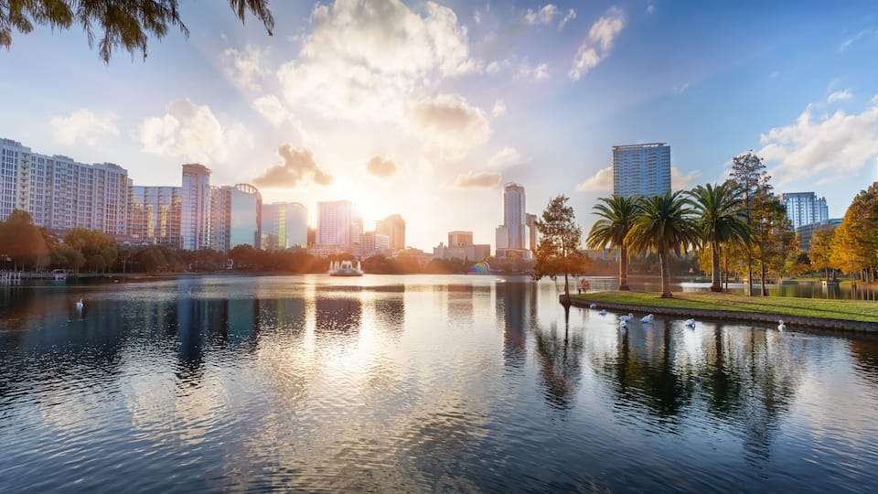 Sunset at Orlando in Lake Eola Park with water fountain and city skyline, Florida, USA