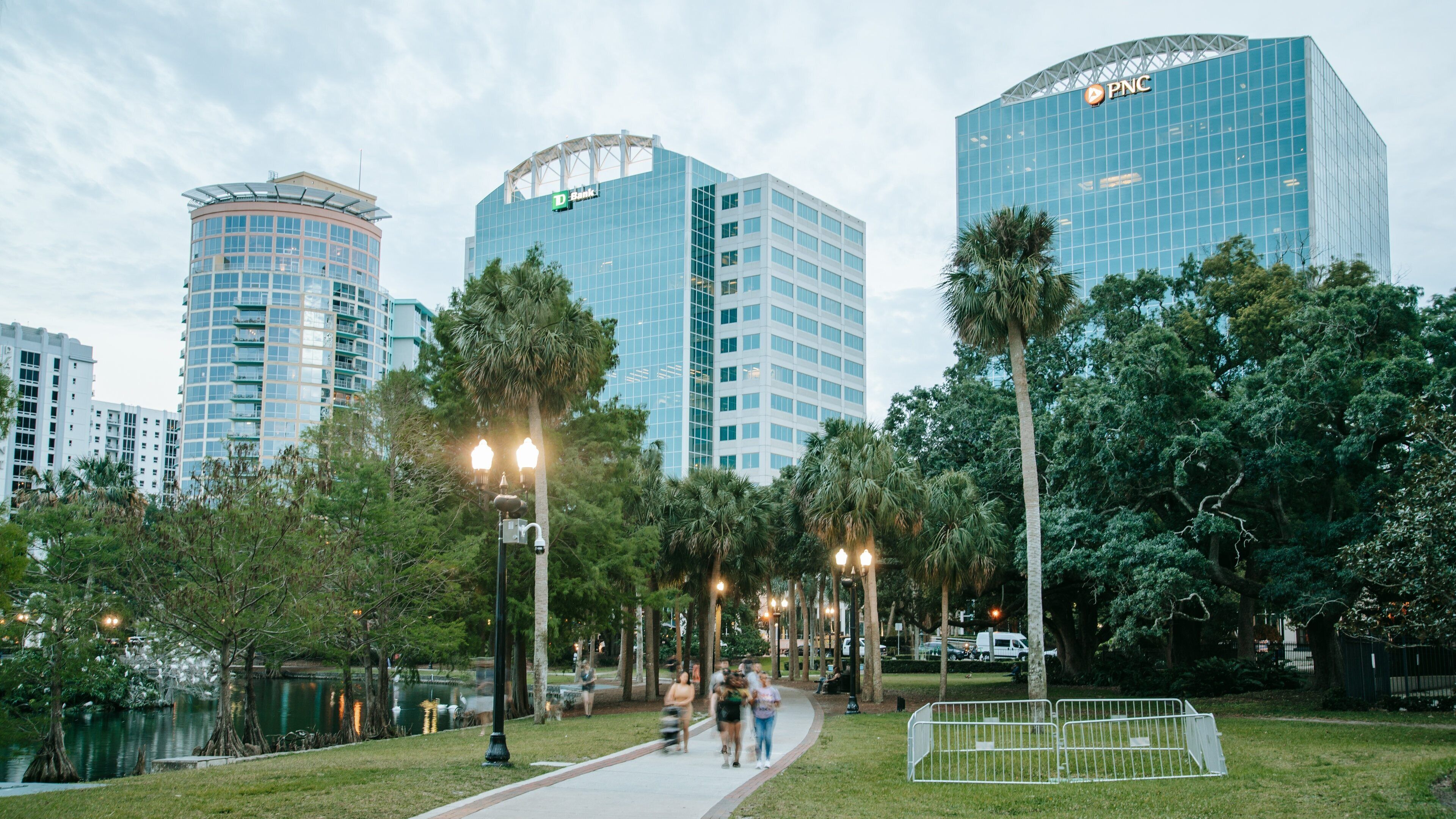 Lake Eola Park featuring a garden and a city