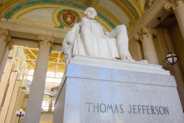 Missouri History Museum featuring a statue or sculpture, signage and interior views