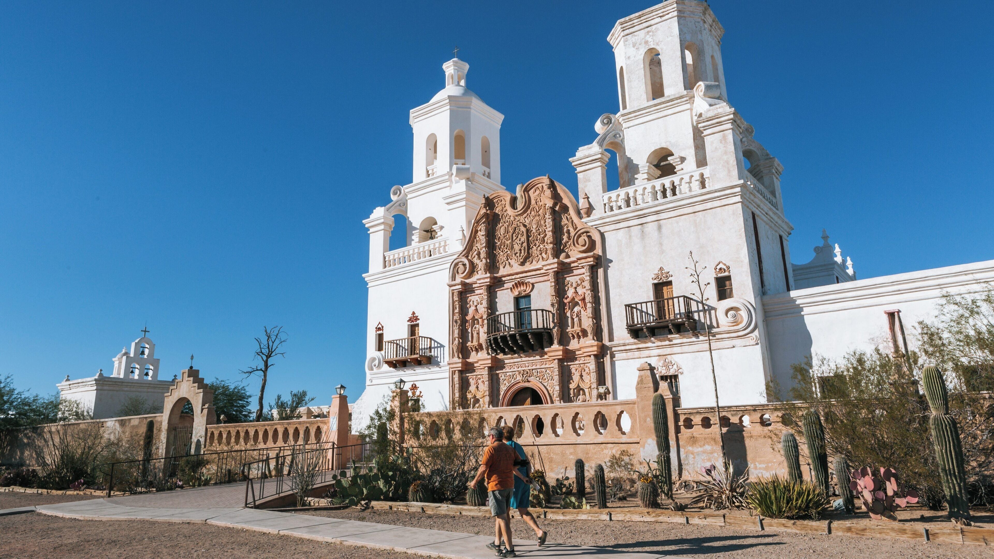 Mission San Xavier del Bac showcases stunning architecture and rich history in Tucson, Arizona under a clear blue sky