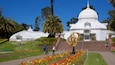 Conservatory of Flowers featuring outdoor art, heritage elements and a park