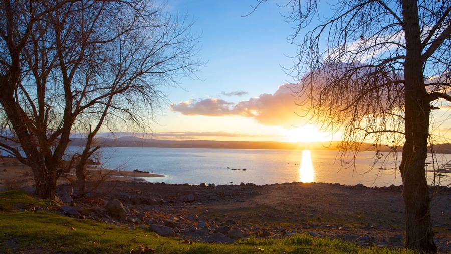 Folsom Lake State Recreation Area which includes a sunset, a lake or waterhole and landscape views