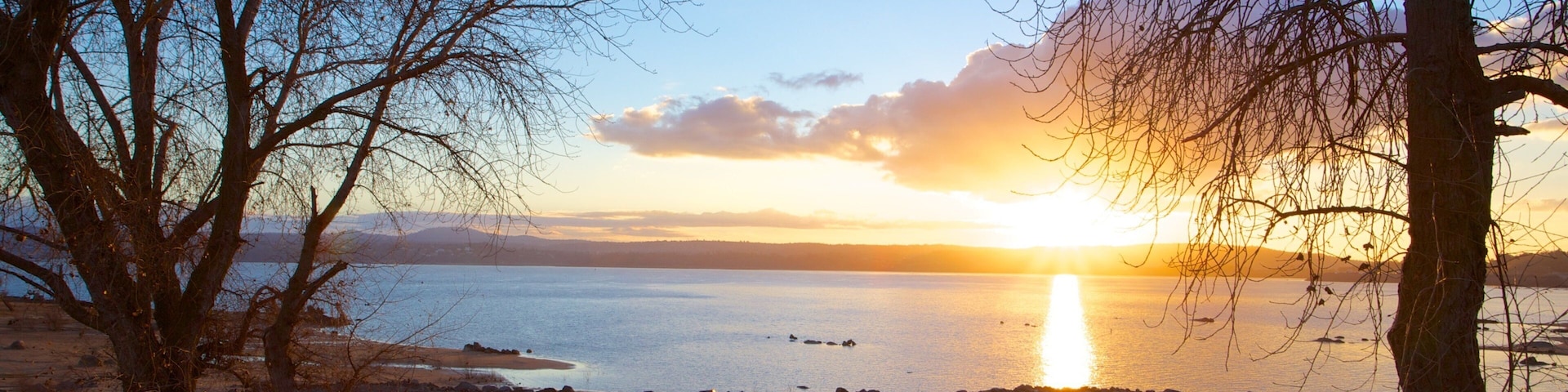 Folsom Lake State Recreation Area which includes a sunset, a lake or waterhole and landscape views