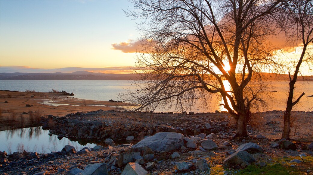 Folsom Lake State Recreation Area featuring a sunset and a lake or waterhole