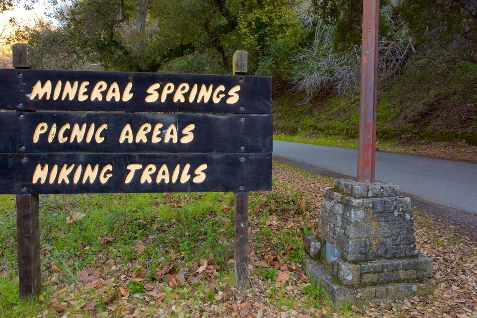 A sign listing attractions: mineral springs, picnic areas, and hiking trails.