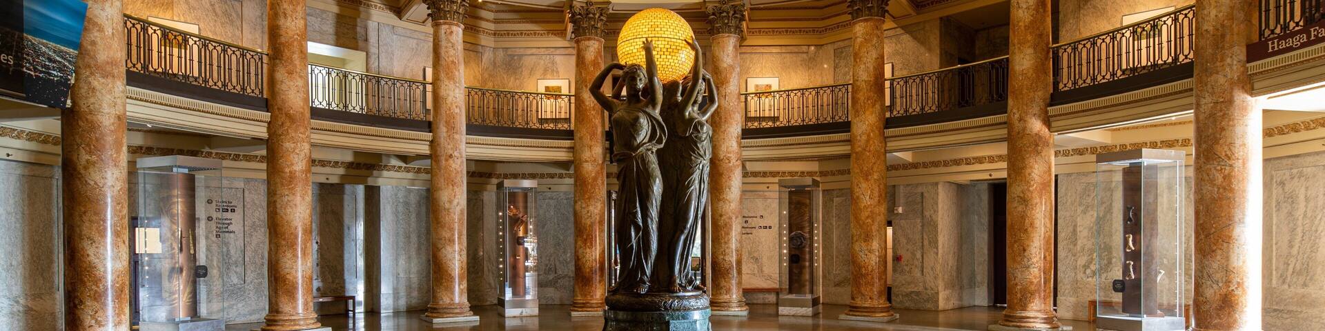 Natural History Museum of Los Angeles County which includes a statue or sculpture and interior views