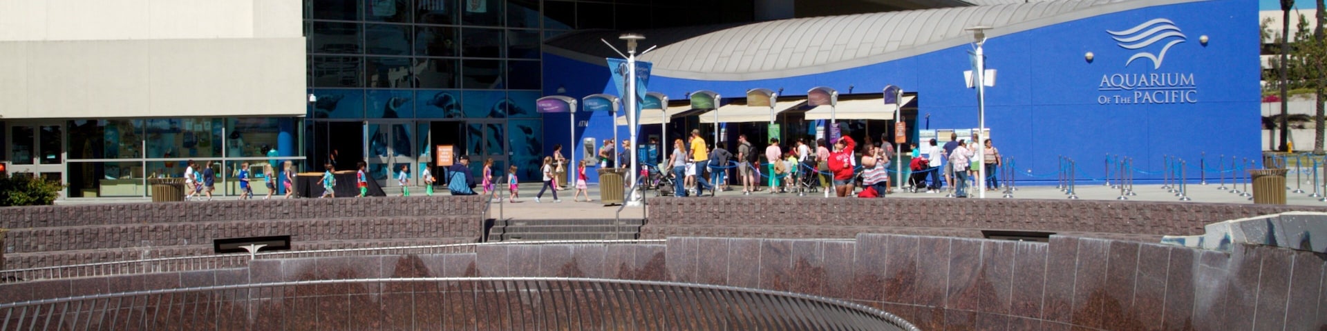 Visitors explore the Aquarium of the Pacific in Long Beach, California during a sunny day
