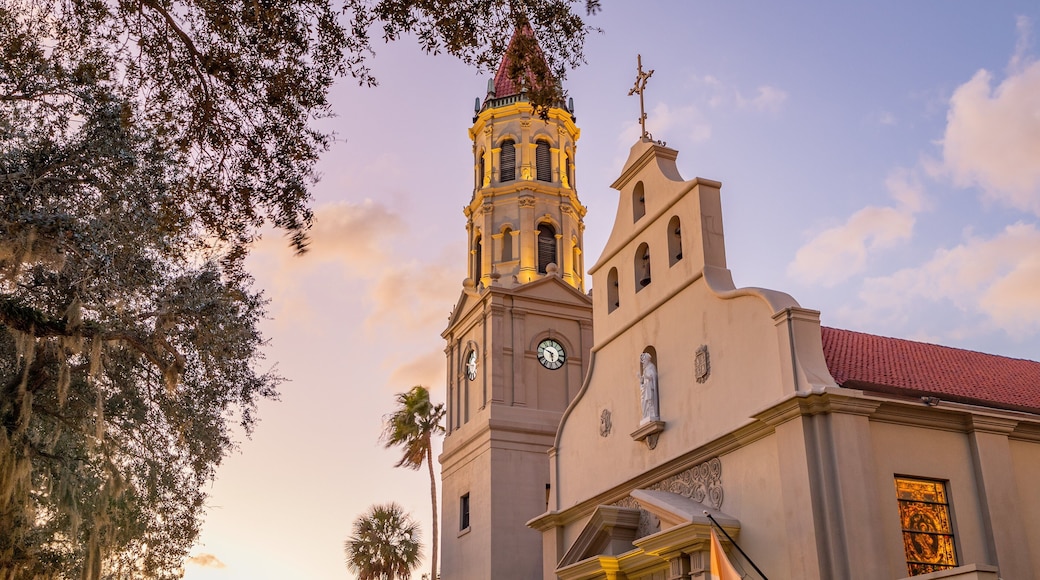 Cathedral Basilica of St. Augustine which includes heritage architecture, a sunset and a church or cathedral