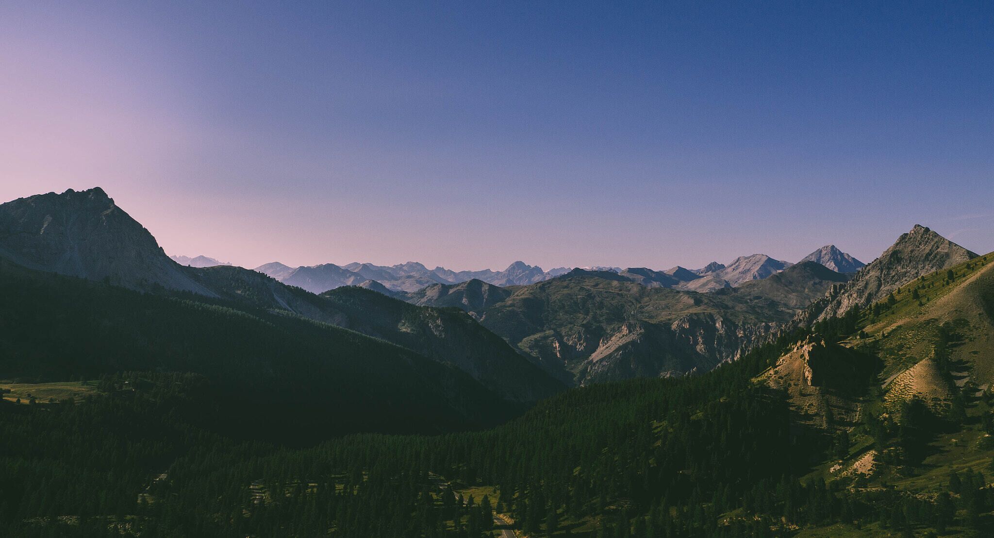 500px provided description: The view from the top of the Col d'Izoard, in France [#sky ,#mountains ,#travel ,#summer ,#view ,#colors ,#panorama ,#landscapes ,#alps ,#alpes ,#wild ,#chains]