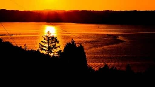 The big island of Orust in the Swedish western archipelago is famous for its many pretty havens and fishing villages. Here, at Morlanda, is where yours truly spends his summers watching this sunset night after night.