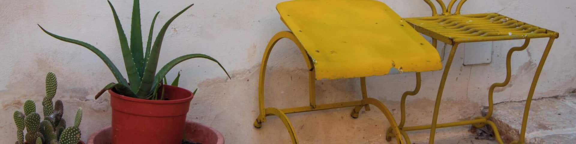 Yellow chairs. Serrano is a town of 1,406 inhabitants of the Province of Lecce, in Apulia, southern Italy. It is a frazione of the comune of Carpignano Salentino and is 13 km from Otranto and 29 from Lecce.