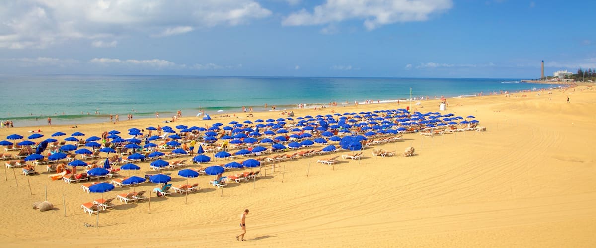 Meloneras showing general coastal views and a sandy beach