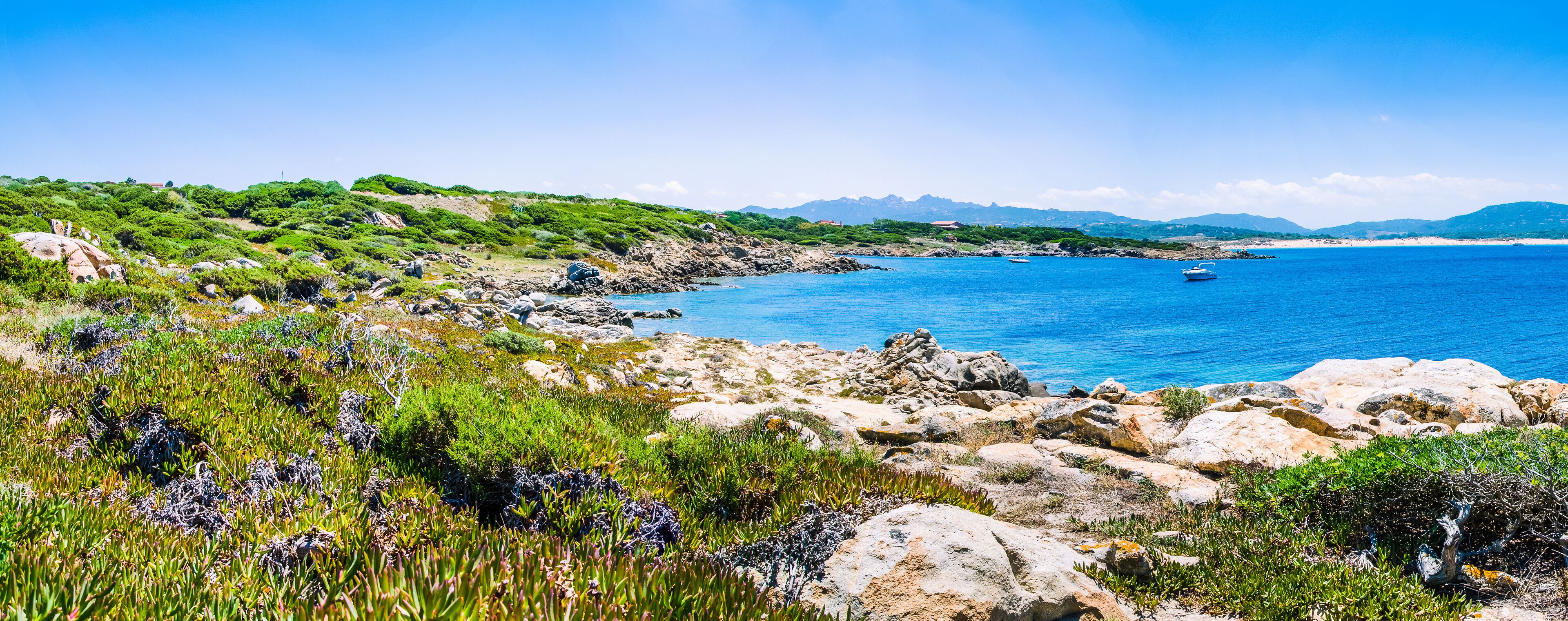 Beautiful costline with granite rocks and amazing azure water on Porto Pollo, Sardinia, Italy