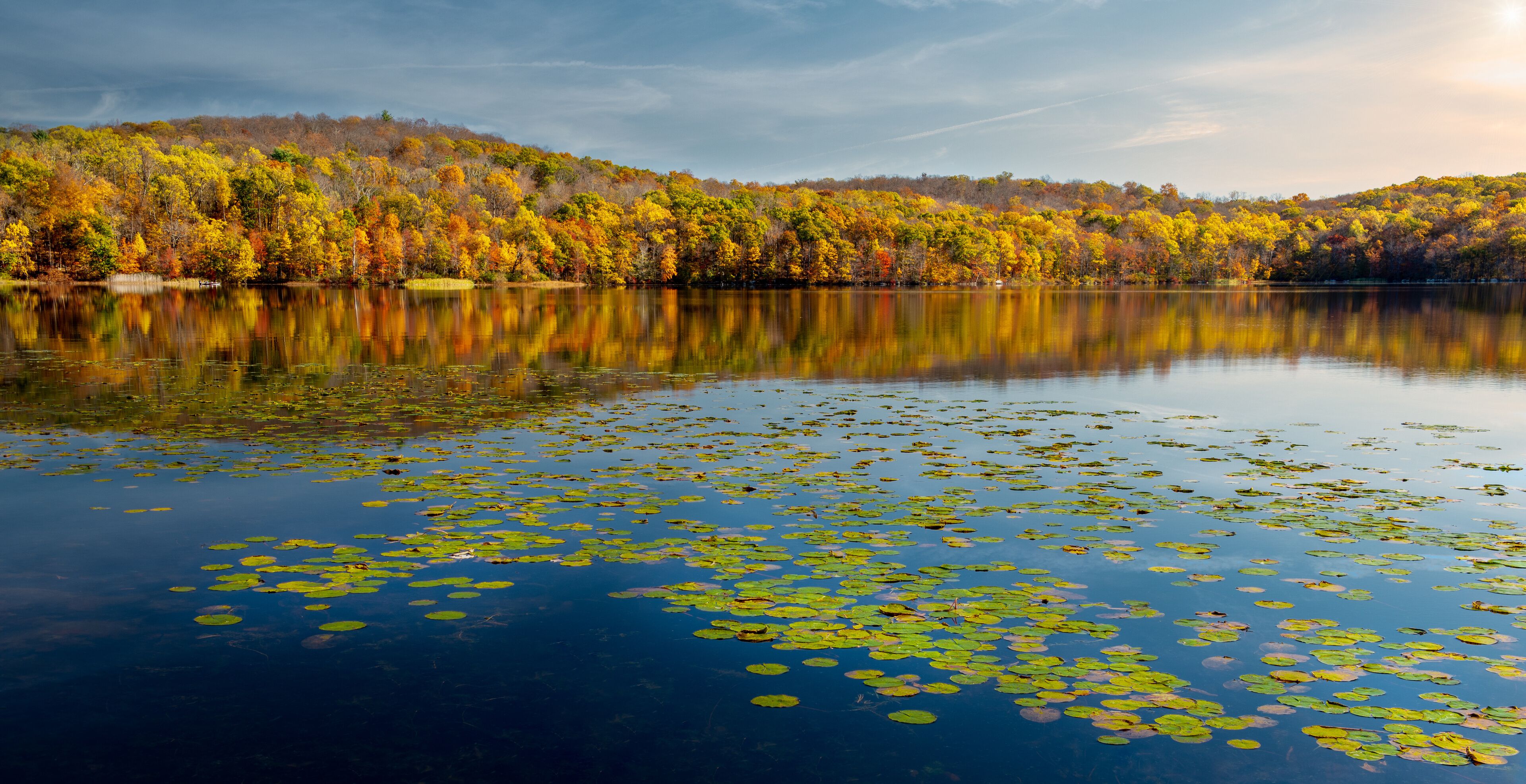 Colorful autumn foliage reflected in Sheppard Pond, Ringwood State Park, New Jersey