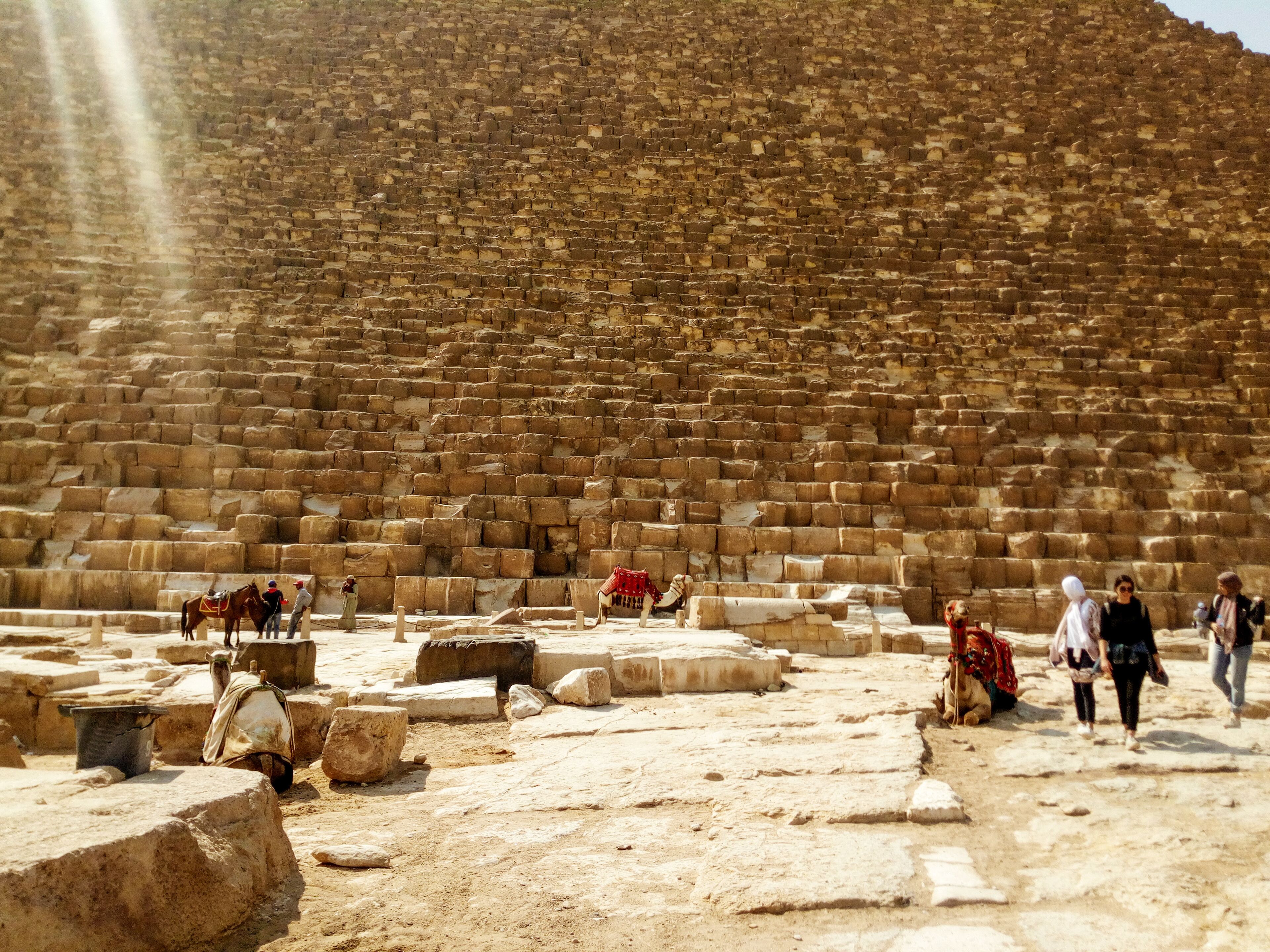 You can't not recommend going to see the pyramids, they're one of the most monumental places I've ever been to. You never truly appreciate the scale of them until you're stood at their feet. You can almost get an impression of their size in this picture. 

I also definitely recommend getting the best view of them by taking a camel ride, there's no experience quite like it.
.
.
#history #pyramid #cairo #tomb #egypt #desert #camels