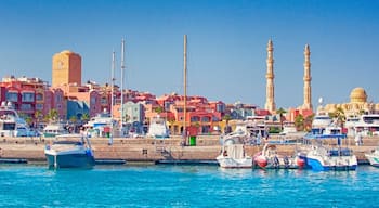 HURGHADA, EGYPT - September 22, 2021 : Marina with tourist boats on Red Sea in sunny day, view from the sea.