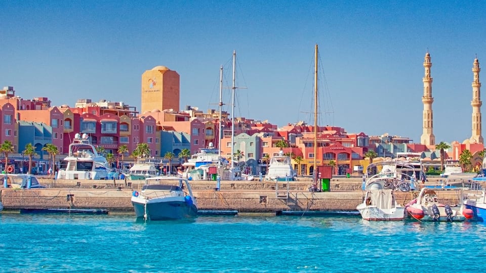 HURGHADA, EGYPT - September 22, 2021 : Marina with tourist boats on Red Sea in sunny day, view from the sea.
