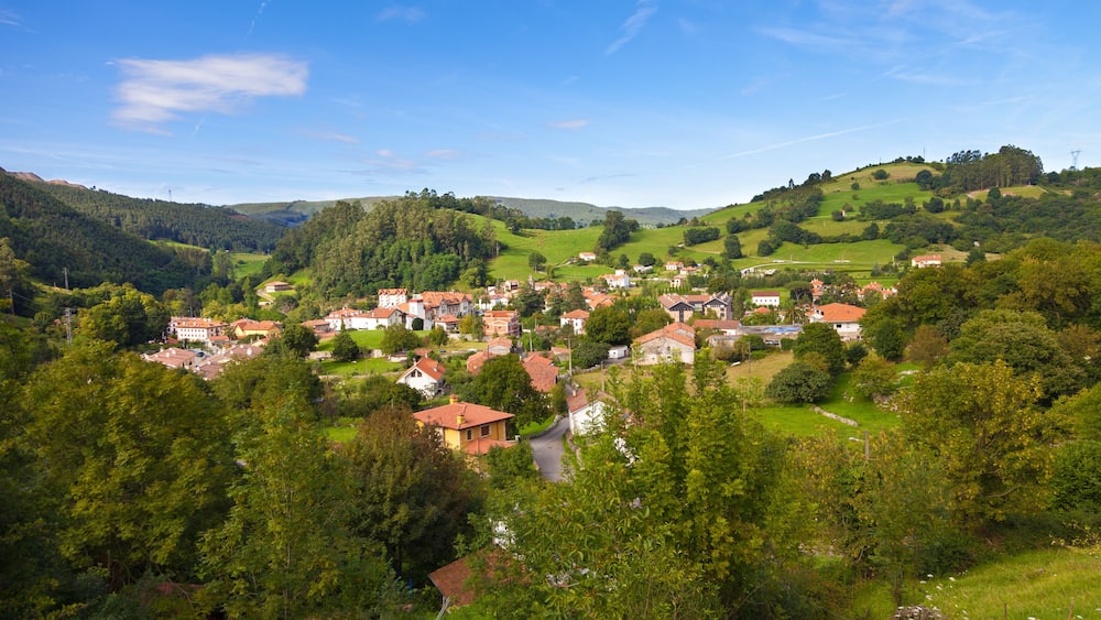 Puente Viesgo roofs. Typical valley with little town rounded by pastures and trees. Cantabria, Spain