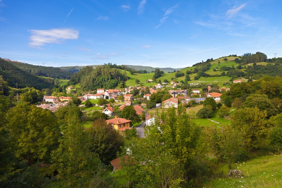 Puente Viesgo roofs. Typical valley with little town rounded by pastures and trees. Cantabria, Spain