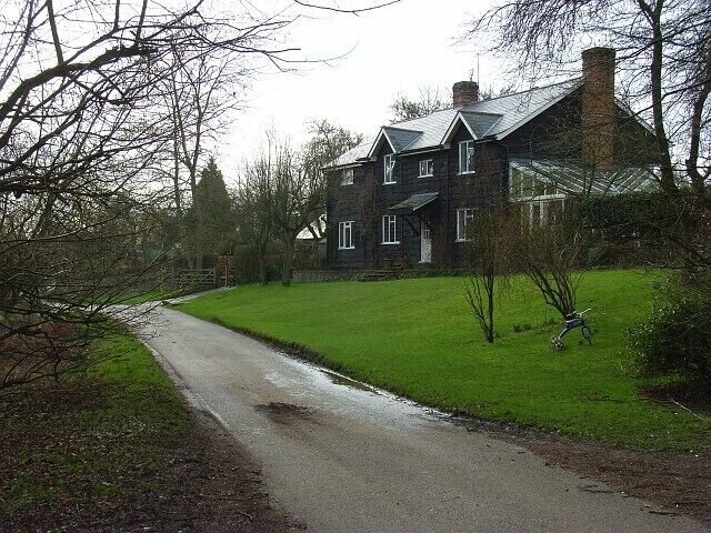 Ibstone Cottage, Ibstone Standing on the lane to the north of Hellcorner Farm, this new house is clad in dark timber. Its slate roof reflects a hint of sunshine.